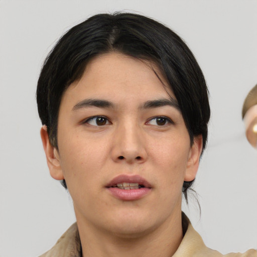 Joyful white young-adult female with medium  black hair and brown eyes