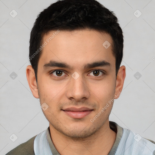 Joyful white young-adult male with short  black hair and brown eyes