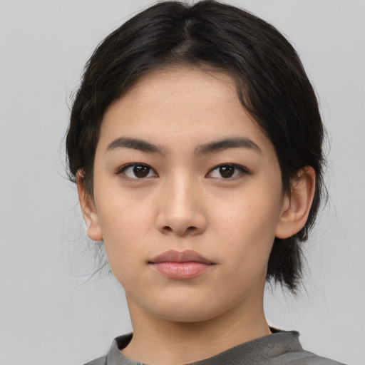 Neutral asian young-adult female with medium  black hair and brown eyes