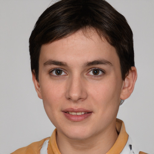 Joyful white young-adult female with short  brown hair and brown eyes