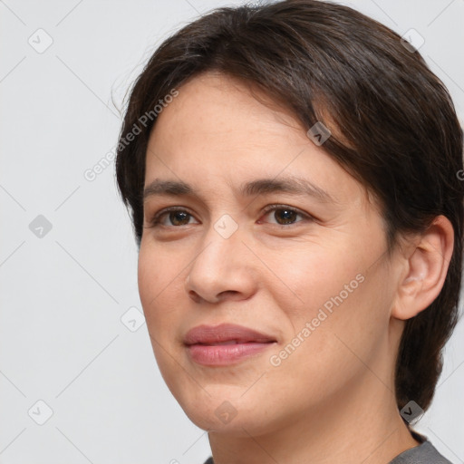 Joyful white young-adult female with medium  brown hair and brown eyes