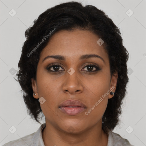 Joyful black young-adult female with medium  brown hair and brown eyes
