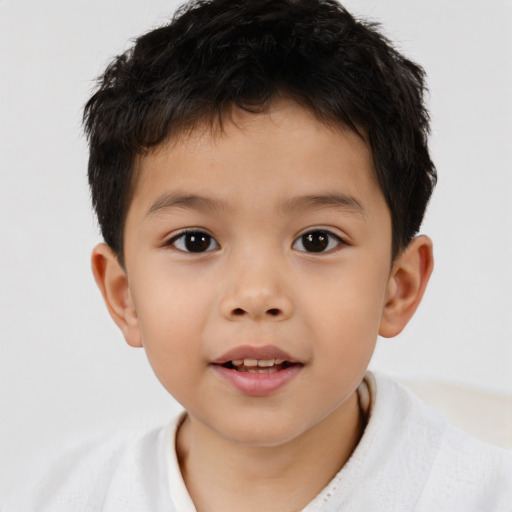 Joyful asian child male with short  brown hair and brown eyes