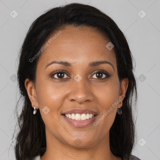 Joyful black young-adult female with medium  brown hair and brown eyes