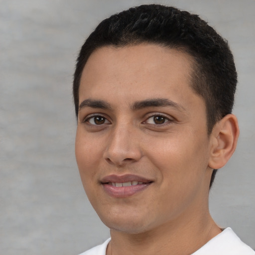 Joyful white young-adult male with short  brown hair and brown eyes