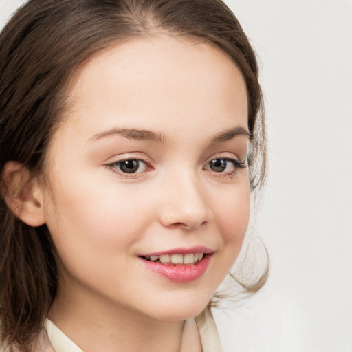 Joyful white child female with long  brown hair and brown eyes