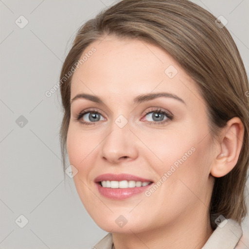 Joyful white young-adult female with medium  brown hair and grey eyes