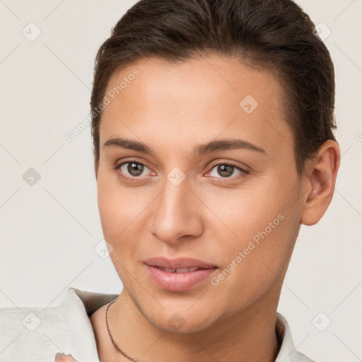 Joyful white young-adult female with short  brown hair and brown eyes