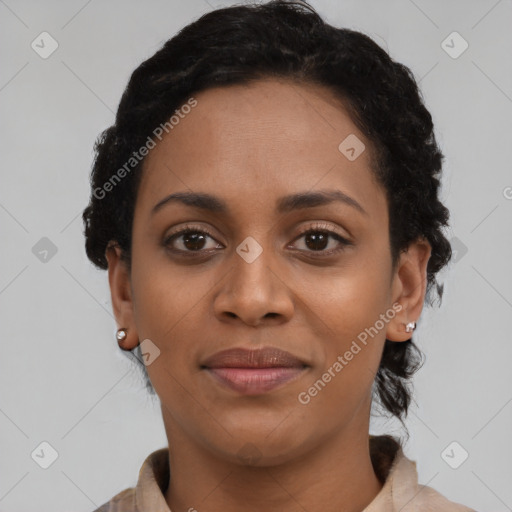 Joyful black young-adult female with short  brown hair and brown eyes