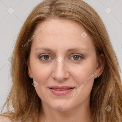 Joyful white adult female with long  brown hair and brown eyes