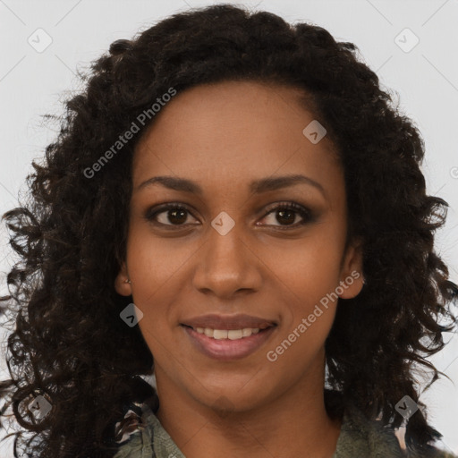 Joyful black young-adult female with long  brown hair and brown eyes