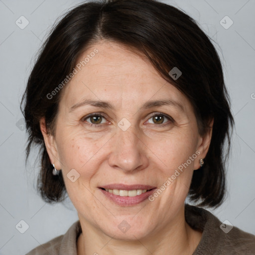 Joyful white adult female with medium  brown hair and grey eyes