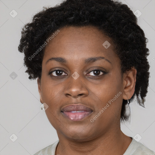 Joyful black adult female with short  brown hair and brown eyes