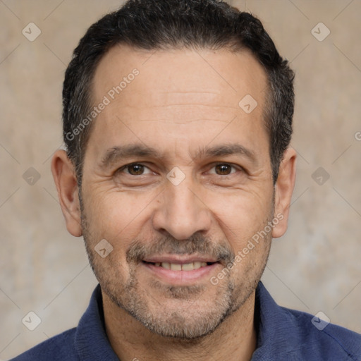 Joyful white adult male with short  black hair and brown eyes