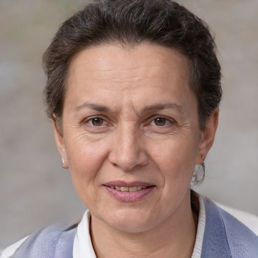 Joyful white adult female with short  brown hair and brown eyes