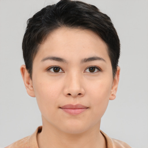 Joyful asian young-adult female with short  brown hair and brown eyes