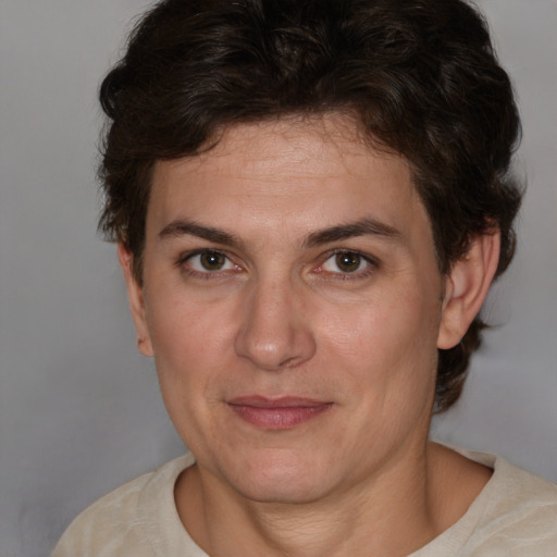 Joyful white adult female with short  brown hair and brown eyes