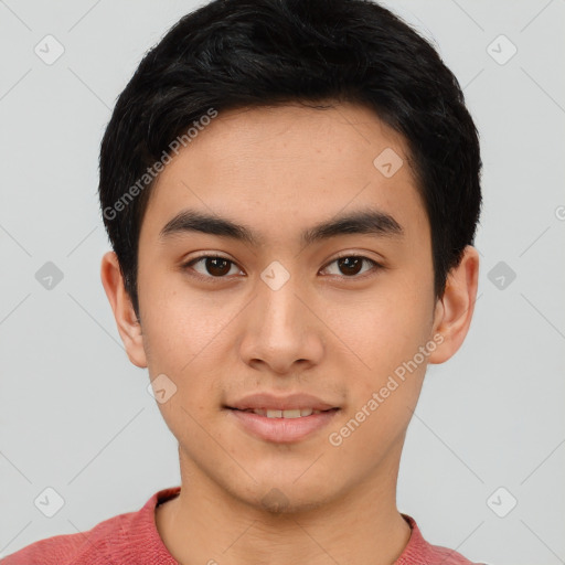 Joyful asian young-adult male with short  black hair and brown eyes