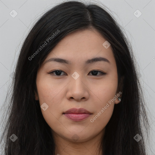 Joyful asian young-adult female with long  brown hair and brown eyes