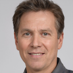 Joyful white middle-aged male with short  brown hair and brown eyes