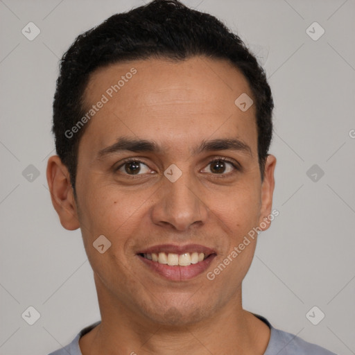 Joyful latino young-adult male with short  black hair and brown eyes