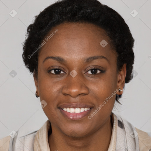 Joyful black young-adult female with short  brown hair and brown eyes