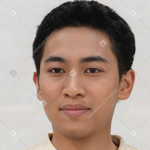 Joyful asian young-adult male with short  brown hair and brown eyes