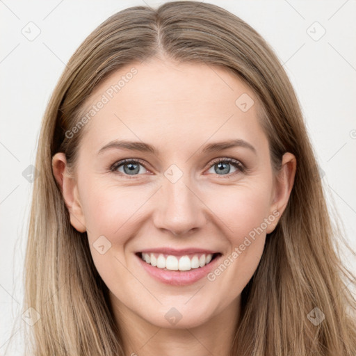 Joyful white young-adult female with long  brown hair and grey eyes