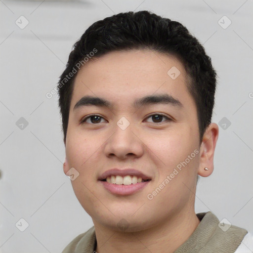 Joyful white young-adult male with short  black hair and brown eyes