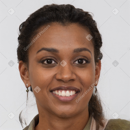 Joyful black young-adult female with short  brown hair and brown eyes