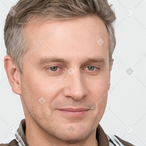 Joyful white adult male with short  brown hair and grey eyes