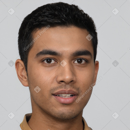 Joyful latino young-adult male with short  black hair and brown eyes