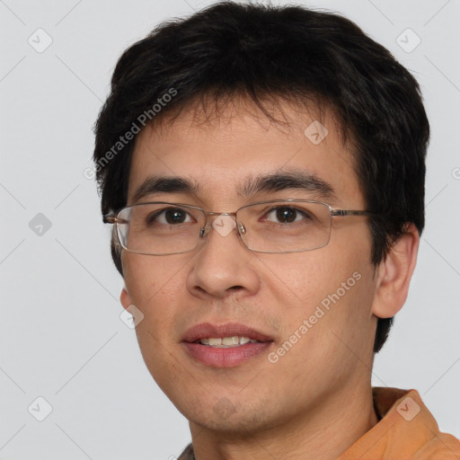 Joyful white young-adult male with short  black hair and brown eyes