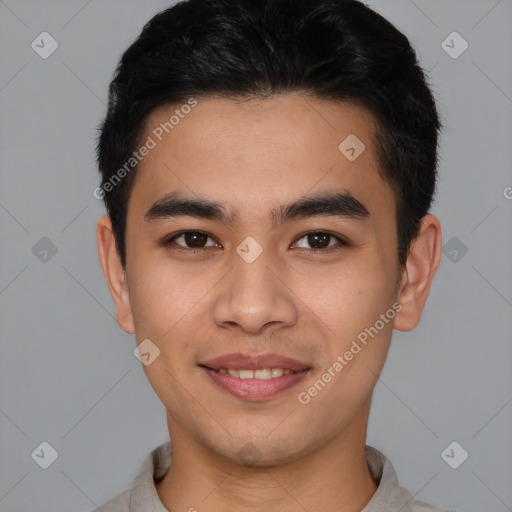 Joyful latino young-adult male with short  brown hair and brown eyes