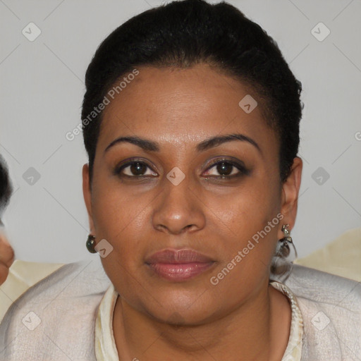 Joyful black young-adult female with short  black hair and brown eyes