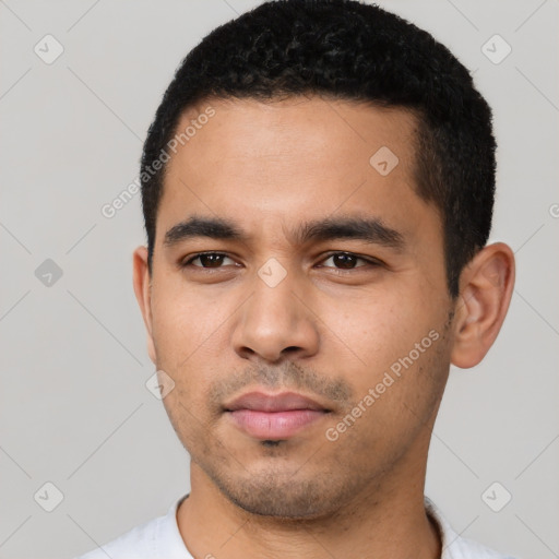 Neutral latino young-adult male with short  black hair and brown eyes