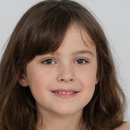 Joyful white child female with medium  brown hair and brown eyes