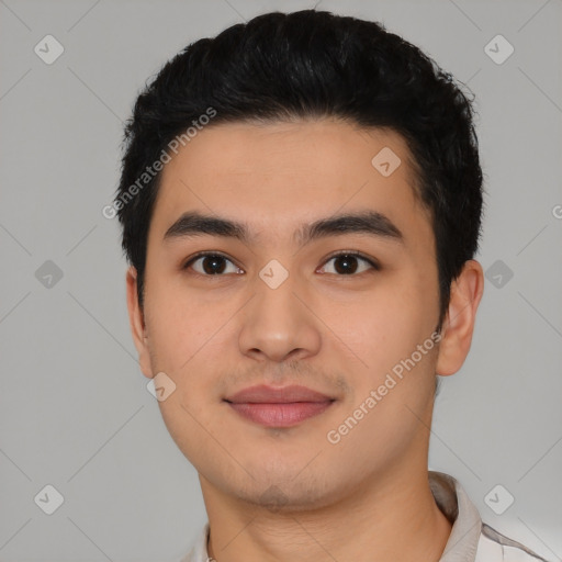 Joyful latino young-adult male with short  black hair and brown eyes