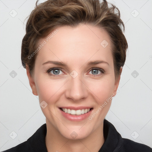 Joyful white young-adult female with short  brown hair and grey eyes