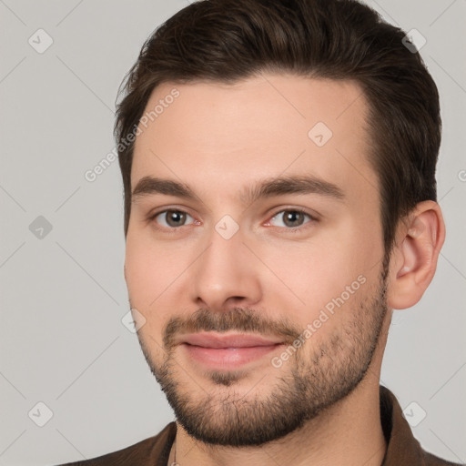 Joyful white young-adult male with short  brown hair and brown eyes