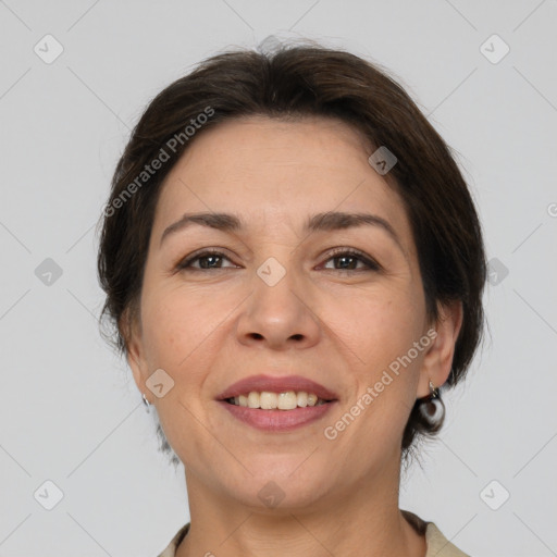 Joyful white adult female with medium  brown hair and brown eyes