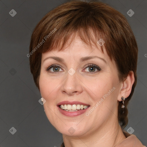 Joyful white adult female with medium  brown hair and grey eyes