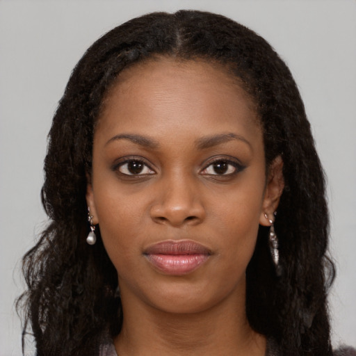 Neutral black young-adult female with long  brown hair and brown eyes
