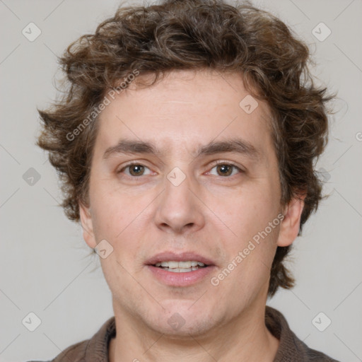 Joyful white adult male with short  brown hair and grey eyes