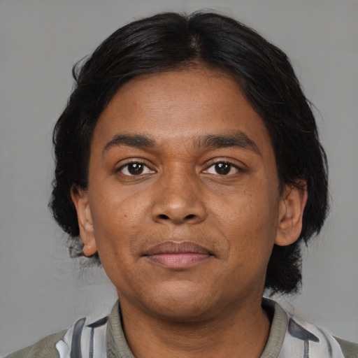 Joyful asian young-adult male with medium  black hair and brown eyes