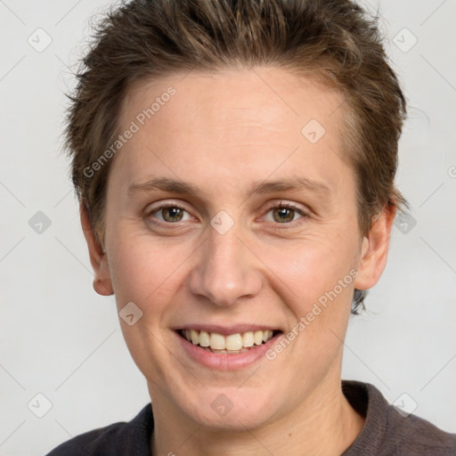 Joyful white adult female with short  brown hair and grey eyes