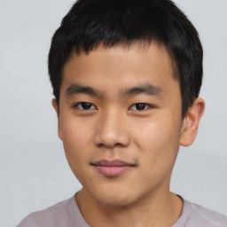 Neutral asian young-adult male with short  brown hair and brown eyes