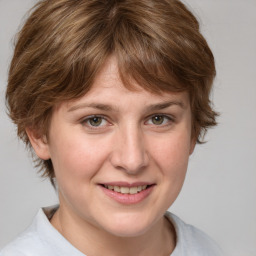 Joyful white young-adult female with medium  brown hair and blue eyes