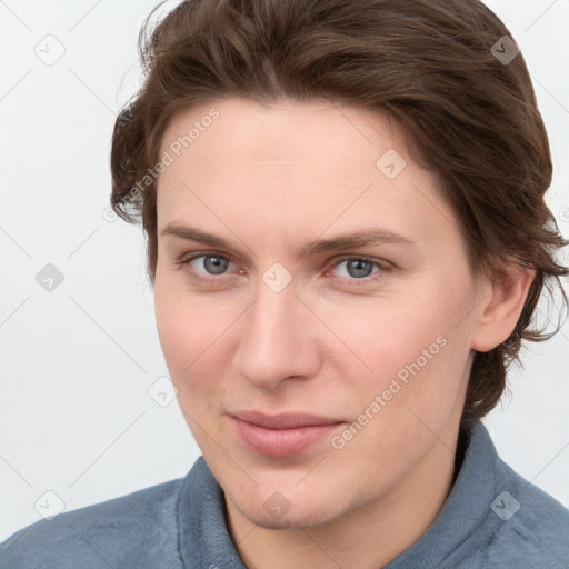 Joyful white young-adult female with medium  brown hair and blue eyes