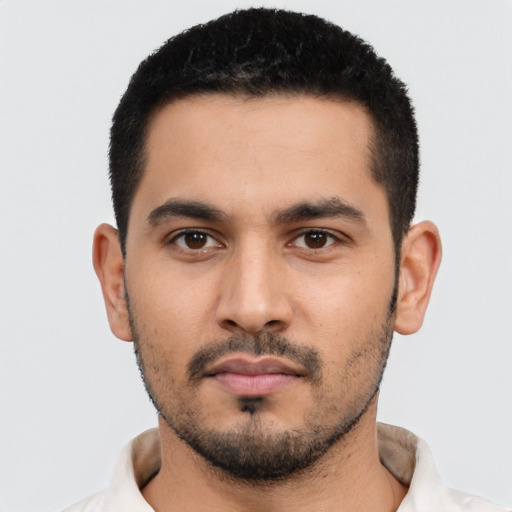Neutral latino young-adult male with short  black hair and brown eyes